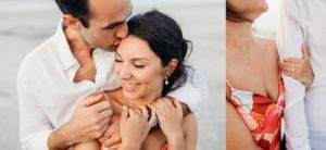man hugging woman emphasis on new engagement ring